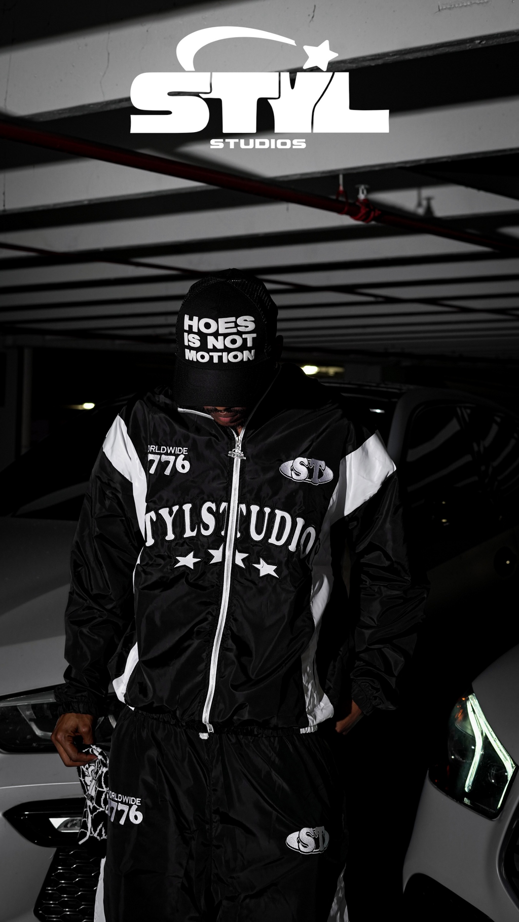 STYL Studios “Hoes Is Not Motion” Trucker Hat