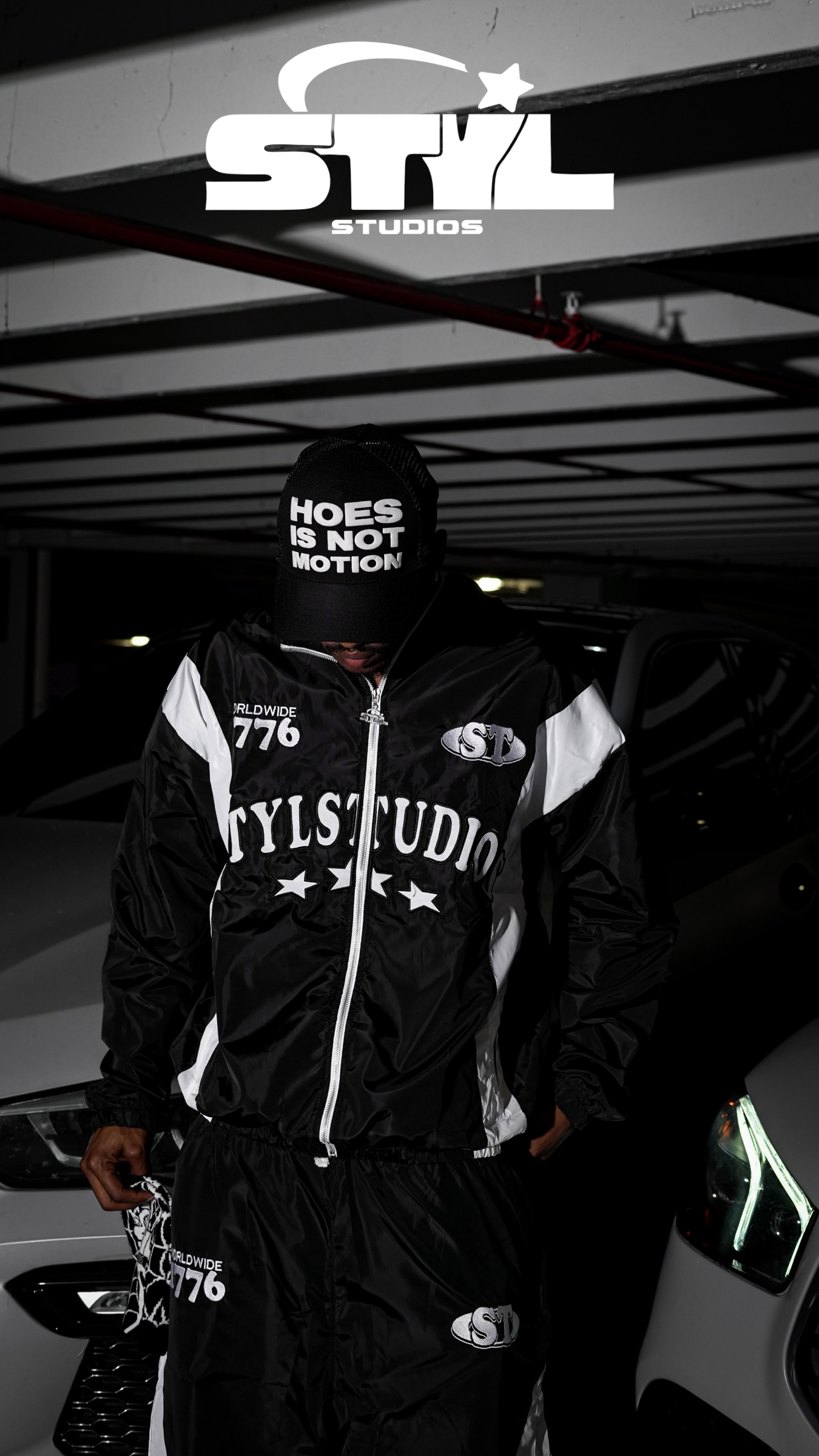 STYL Studios “Hoes Is Not Motion” Trucker Hat